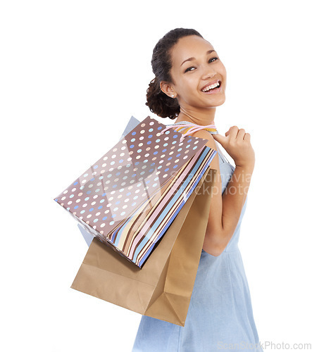 Image of Woman, happy portrait and shopping bag in studio with discount, sale and retail giveaway for commerce. Fashion winner, model or African customer with holiday gift or clothes on a white background