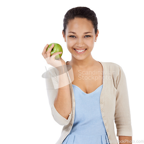 Image of Portrait, apple and happy woman in studio with healthy food choice, healthcare or nutrition benefits. Face of person or model with green fruit for detox, self care or vegan diet on a white background