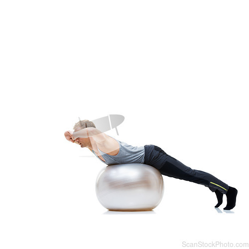 Image of Fitness, training and man with exercise ball in studio for abs, core or balance challenge on white background. Workout, body or male athlete with inflatable for wellness, sports or stretching routine