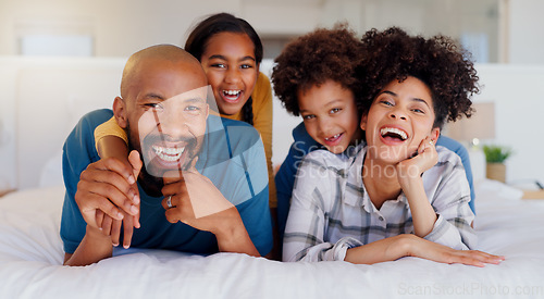 Image of Smile, portrait and children with parents in bed of modern home for bonding together with teddy bear. Happy, fun and young interracial man and woman relaxing with kids in bedroom of family house.