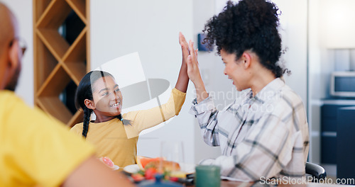 Image of Smile, high five and a family eating breakfast in the kitchen of home together in the morning for health. Food, love or support with a mother and daughter bonding or enjoying a meal for nutrition