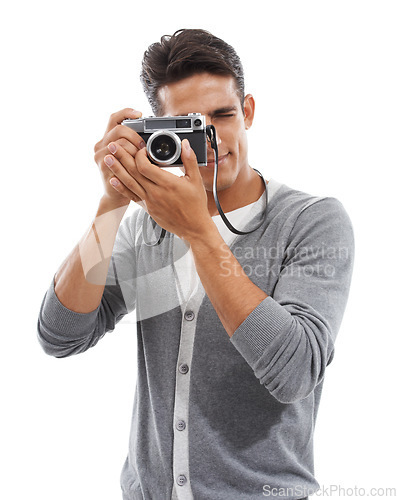 Image of Photography artist, man and digital camera in studio for photoshoot, creative production or content creation on white background. Journalist, cameraman and photographer click lens for media magazine