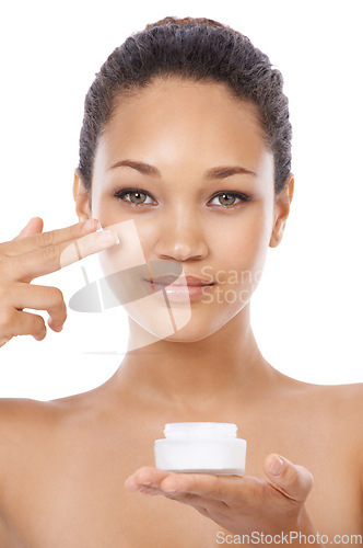 Image of Young woman, portrait and beauty cream, skincare and cosmetics on a white background. Face of an African model or person with moisturizer application, skin care product and dermatology in studio