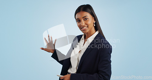 Image of Business woman, portrait and presentation of anchor in advertising on a blue studio background. Female person or employee reporter and speaking, teaching or showing information on mockup space