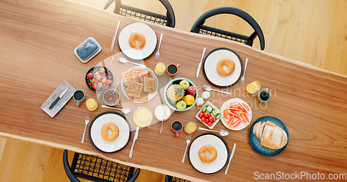 Image of Healthy, breakfast and food on dining table with top view, fruit and coffee for wellness and nutrition. Morning, brunch and meal with waffles, donut and cutlery for snack or gourmet diet from above