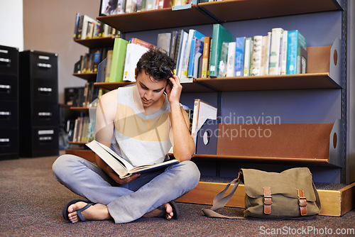 Image of Reading book, floor or student in library at university, college or school campus for education growth. Bookshelf, learning or smart man with scholarship studying knowledge, research or information