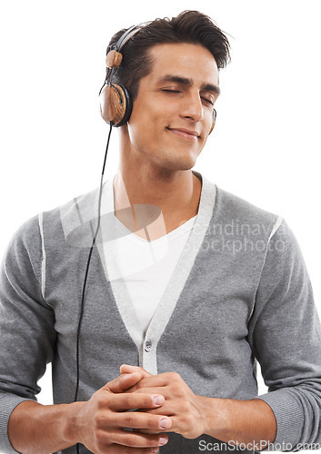 Image of Music, man and headphones in studio for calm connection, audio subscription and streaming multimedia playlist on white background. Happy model listening to peaceful podcast, hearing sound and radio