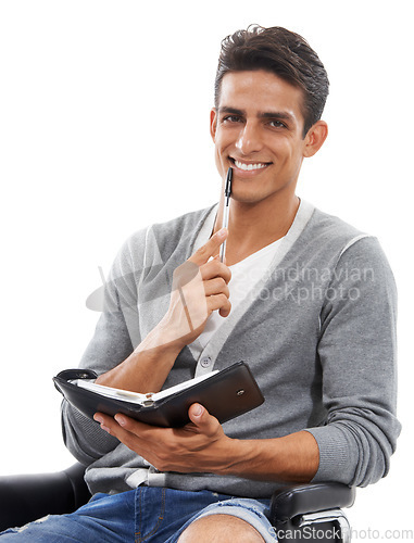 Image of Businessman, portrait and book or happy in studio for planning, schedule and writing information or research. Person, face or entrepreneur and diary or notebook for administration on white background