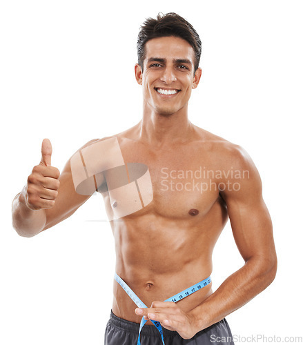 Image of Man is shirtless, measuring tape and thumbs up, check weight progress for health and fitness isolated on white background. Smile in portrait, success or okay with body goal and muscle in studio