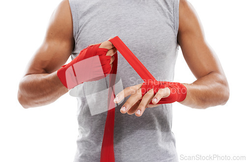 Image of Hands, wrapping with red cloth and boxing, fitness and person training in martial arts isolated on white background. Closeup of fighter strapping wrist, protection or safety with MMA in a studio