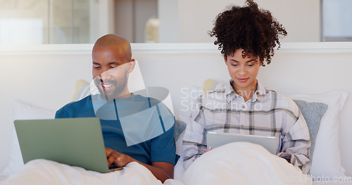 Image of Home, bed and black couple with a laptop, technology and smile with love, internet and streaming a movie. Bedroom, apartment or man with woman, connection or film with bonding, happy and marriage