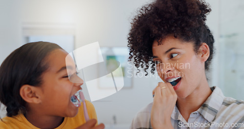 Image of Hygiene, bathroom and mother brushing teeth with child for oral health and wellness at home. Bonding, happy and young mom and girl kid with morning dental care routine together at house in Mexico.
