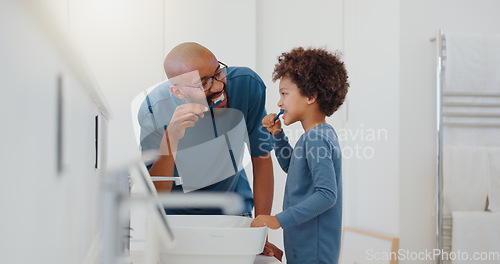 Image of Hygiene, bathroom and father brushing teeth with child for oral health and wellness at home. Bonding, happy and young dad and boy kid with morning dental care routine together at house in Mexico.