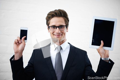 Image of Business man, tablet and phone screen with smile, portrait and mock up space for promotion by wall background. Entrepreneur, person and happy employee with blank smartphone, touchscreen or ux for app