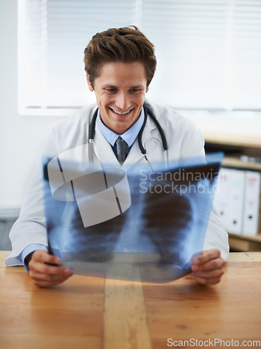 Image of Man doctor in office, check xray and health, medical diagnosis and review of lung scan at cardiology clinic. Radiology, assessment of results and human anatomy with happy surgeon, MRI and skeleton