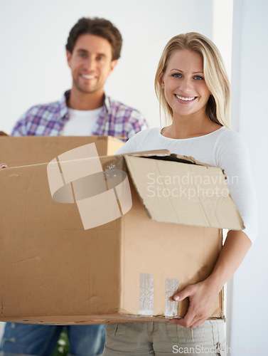 Image of Smile, boxes and portrait of couple in new home living room for unpacking and moving together. Happy, love and young man and woman from Australia with cardboard packages in home or apartment.