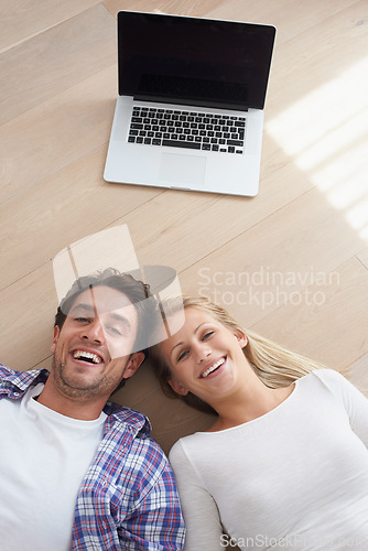 Image of Couple, portrait and living room floor with laptop, marriage and relax for love, home and happy. Wife, husband and smile for commitment, bonding together and care for relationship, man or woman