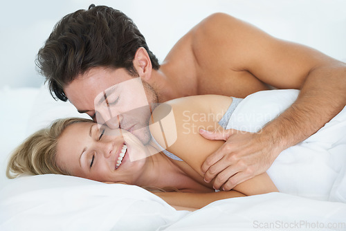 Image of Man, kiss or happy woman sleeping in bed for peace or dreaming to relax on holiday vacation. Wake up, romantic love or couple on break together enjoying nap, bedroom sleep or resting at night in home