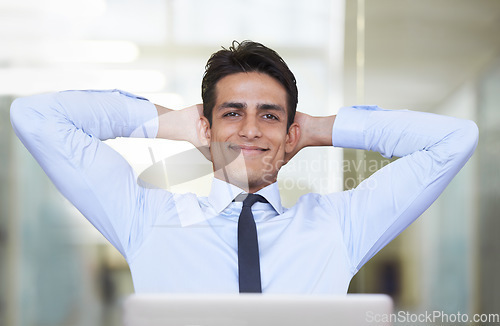 Image of Businessman, happy and thinking in office by laptop, smiling and contemplating proposal or review. Male professional, technology and internet connection for online research, confidence and pride