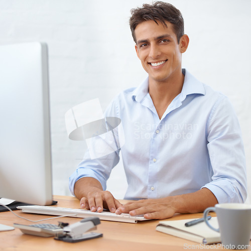 Image of Happy man, typing or portrait with computer at office with pride for career ambition or opportunity. IT support, business or male employee programming with research online at workplace or desk on pc
