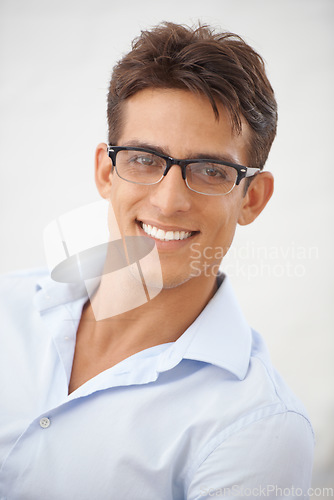 Image of Man, face and glasses for vision with eye care, happy with optometry and professional style on white background. Smile in portrait for eyesight with fashion frame and prescription lens in studio