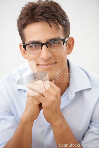 Image of Man, face and glasses for vision with smile, eye care or optometry with professional style on white background. Smart, confident in portrait with fashion frame and prescription lens in studio