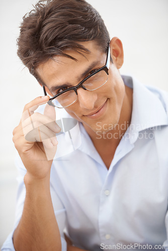 Image of Man, glasses for vision with eye care and optometry, face with professional style isolated on white background. Smart, nerd and smile in portrait with fashion frame and prescription lens in studio