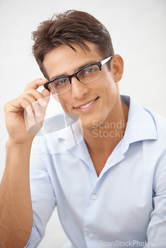 Image of Happy man, face and glasses choice for vision with eye care, optometry and professional style on white background. Smile in portrait for eyesight with fashion frame and prescription lens in studio