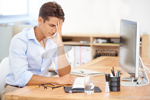 Image of Businessman, headache and stress on computer in mistake, burnout or fatigue at the office. Frustrated man or employee with migraine in anxiety, mental health or work pressure by PC desk at workplace