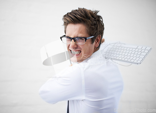 Image of Man, angry and hitting with keyboard, boss and portrait to employee for work, report or job. Frustrated, employer and furious on white background, problem or failure with bad news, stress or risk