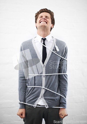 Image of Man, electrician and tied with cord, boss and portrait for employee, work, angry or job. Frustrated, employer and furious on white background, problem or failure with bad news, stress or risk
