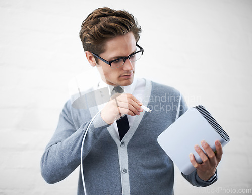 Image of Man, job and hard drives for storage space, geek and cables for computer, working and young. Technician, excited and laughing with corporate clothes, fashionable and glasses for technology computing