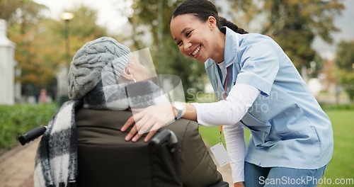 Image of Nurse, happy and park with old woman in a wheelchair for retirement, elderly care and physical therapy. Trust, medical and healthcare with senior patient and caregiver in nature for rehabilitation