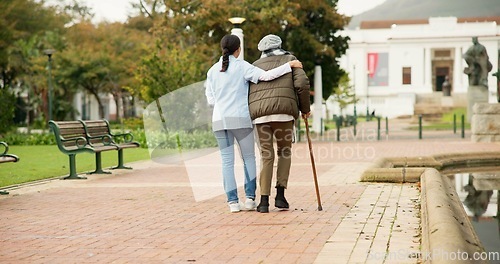 Image of Nurse, relax and park with old woman and walking stick for retirement, elderly care and physical therapy. Trust, medical and healthcare with senior patient and caregiver in nature for rehabilitation