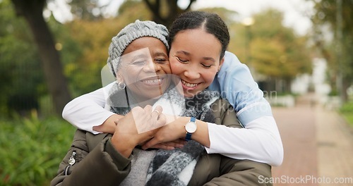 Image of Caregiver, hug and park with old woman in a wheelchair for retirement, elderly care and physical therapy. Trust, medical and healthcare with portrait of patient and nurse in nature for rehabilitation