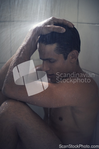 Image of Man, shower and depression or stress in bathroom and grooming in morning routine, water and care for healthy skin. Male person, cosmetology and skincare or clean, naked and mental health at home