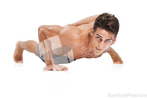 Image of Man, portrait and push up or workout in studio, core and cardio exercise for muscle development. Male person, athlete and face by white background, bodybuilding and performance challenge or fitness