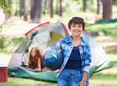 Image of Sleeping bag, camping or portrait of happy kid in park for adventure or holiday vacation in nature. Relax, start or boy with smile in woods, garden or forest ready for fun hiking, travel or wellness