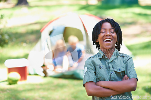 Image of Boy, kid laughing with arms crossed at summer camp and nature with fun outdoor for youth. African child at campsite in park, adventure and vacation, childhood with recreation and happy in portrait