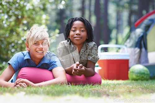 Image of Camping, children and relaxing in portrait on grass, bonding and happy for outdoor adventure. Kids, face and smiling together on holiday, friendship and vacation in nature, relaxing and ground