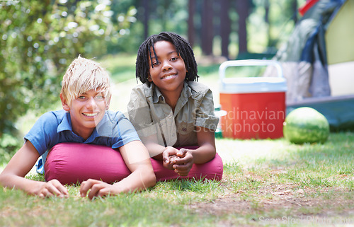 Image of Camping, children and relaxing in portrait on ground, bonding and boys in outdoor adventure. Happy kids, face and smiling together on holiday, friendship and vacation in nature, outside and grass