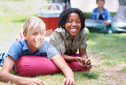 Image of Camping, children and relaxing in portrait on outdoor adventure, bonding and happy outside. Kids, face and smiling together on holiday, friendship and vacation in nature, park and grass on ground