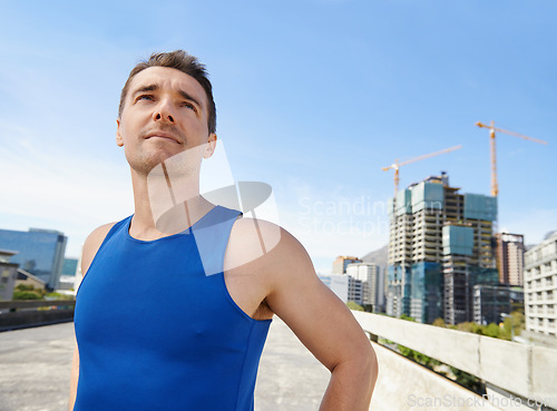 Image of Happy man, fitness and vision in city for workout, exercise or outdoor training in Cape Town. Face of young male person or athlete smile for run, cardio or health and wellness in an urban town