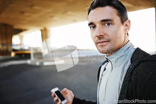 Image of Man, portrait and checking fitness progress in outdoors, screen and exercise or training for marathon. Male person, athlete and workout by city background, mobile app and performance challenge