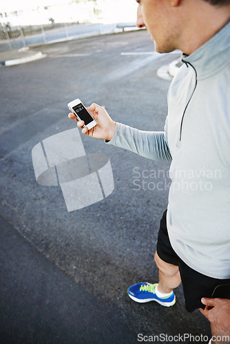 Image of Man, runner and checking phone for progress, screen and exercise or training for marathon. Male person, athlete and workout by city background, mobile app and performance challenge or timer on road