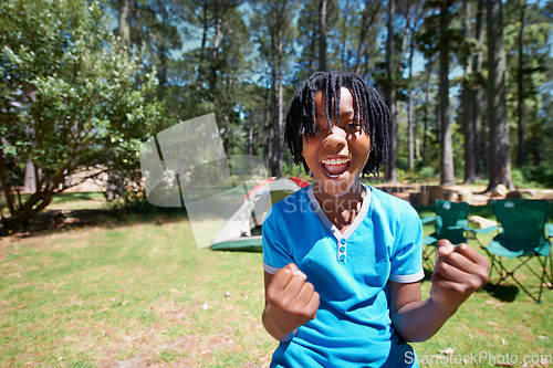 Image of Child, portrait and excited for camping adventure in outdoors, happy and relaxing on vacation or holiday. Black male person, kid and face or confident in park, childhood and summer or freedom on lawn