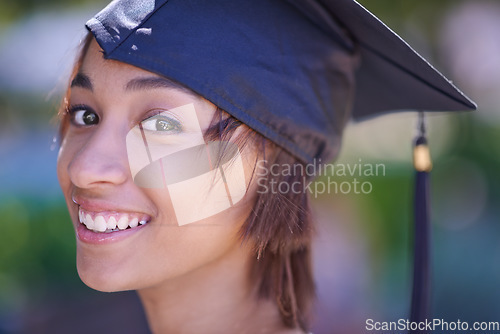 Image of Woman, graduate and college success with education, cap and gown for ceremony outdoor. Academic, smile in portrait and graduation event for achievement, higher learning and certified with pride
