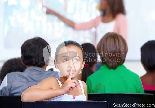 Image of Hush sign, secret or child in classroom with mystery, gossip or fingers on mouth for quiet learning. Lips, news or girl student with whisper or shush gesture for rumor, drama or silence in school