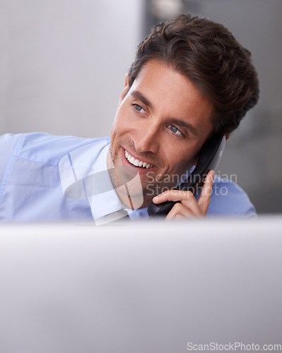 Image of Businessman, phone call and smile on landline in workplace, contact and consulting in office. Businessperson, professional and communication or discussion, technology and connection for networking