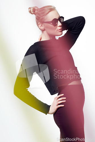Image of Woman, beauty and neon light streak, cosmetics or makeup with creativity and sunglasses isolated on white background. Art deco, fashion and bright color in studio, glamour and elegance with style